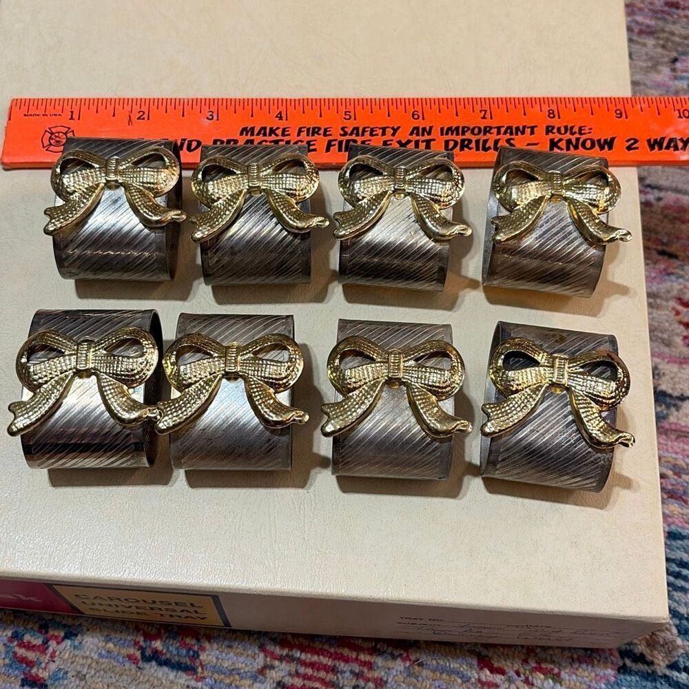 Napkin rings by Davco Silver with golden bows eight pieces